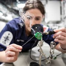 A royal navy engineer using some equipment