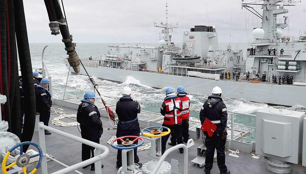 RFA Tidespring conducts her first ever RAS with a Royal Navy Warship HMS Sutherland in the background