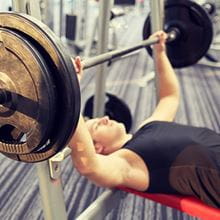 man doing bench press