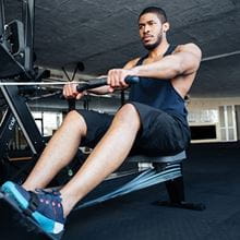 man on rowing machine