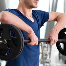 man lifting weights