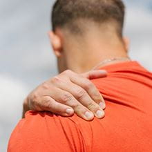 man with hand on shoulder