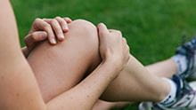 person holding knee