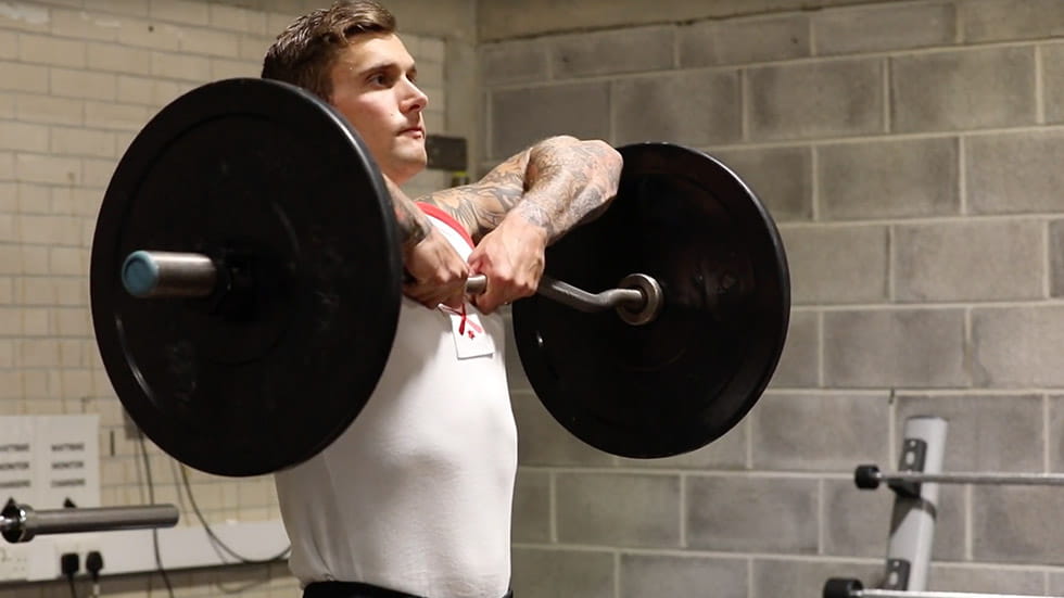 Physical instructor upright row technique
