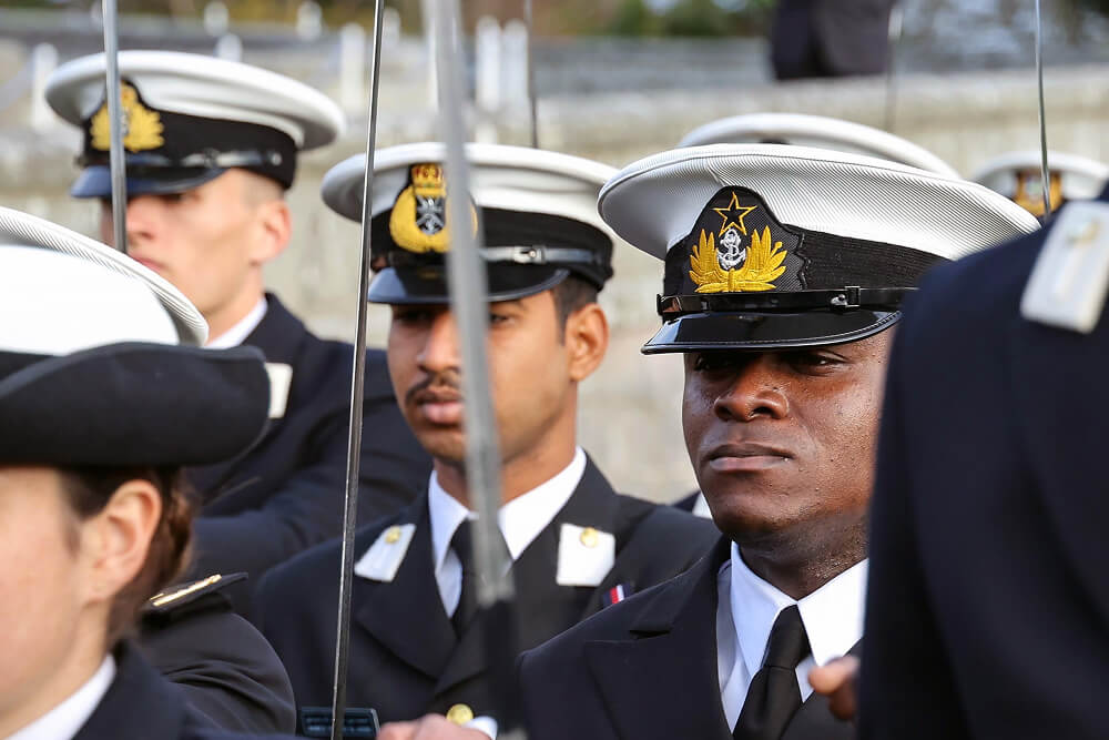 A cropped colour image shows a group of Reserve Officers in formal Royal Navy uniforms.