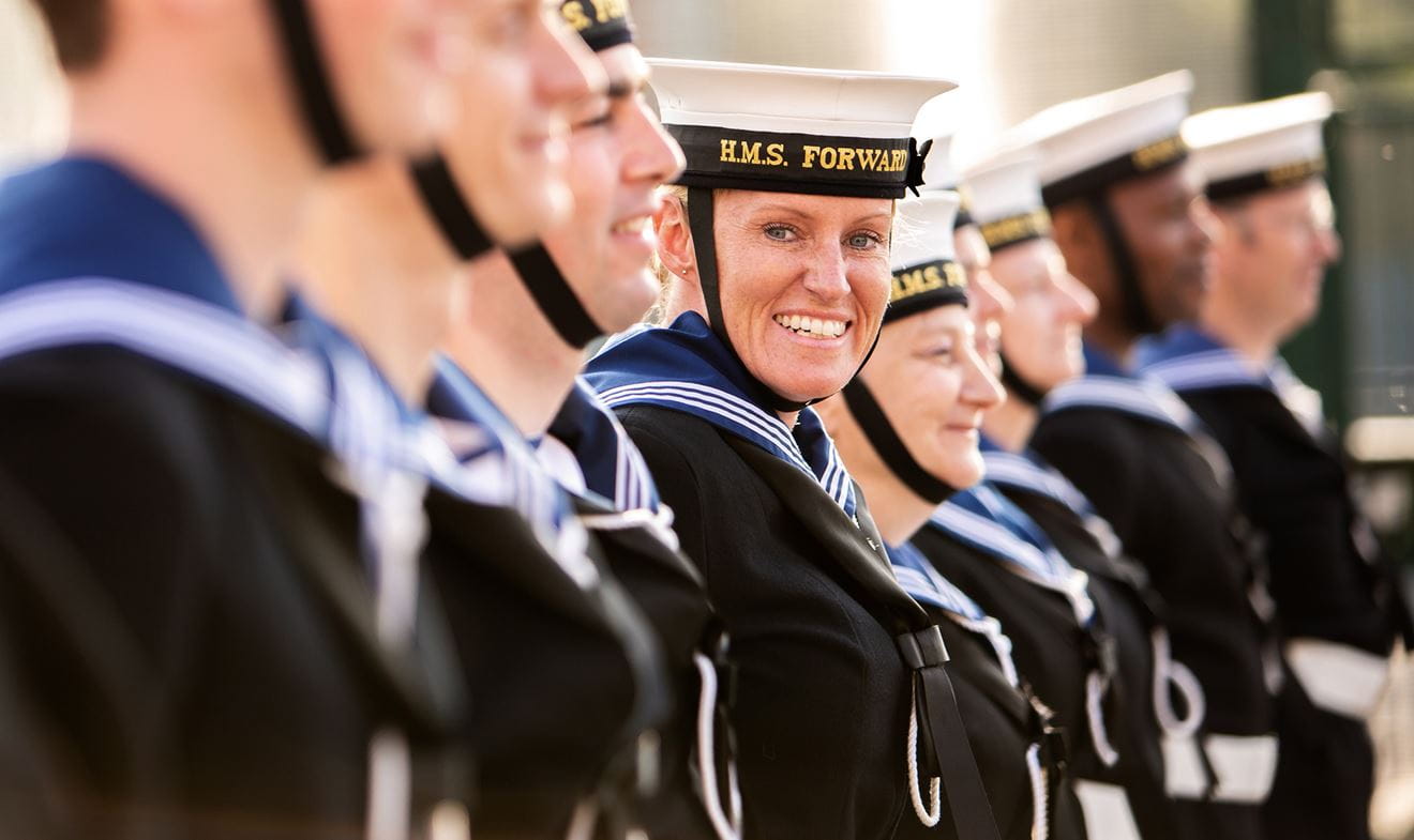 Royal Navy reservist in a line-up looking at the camera smiling