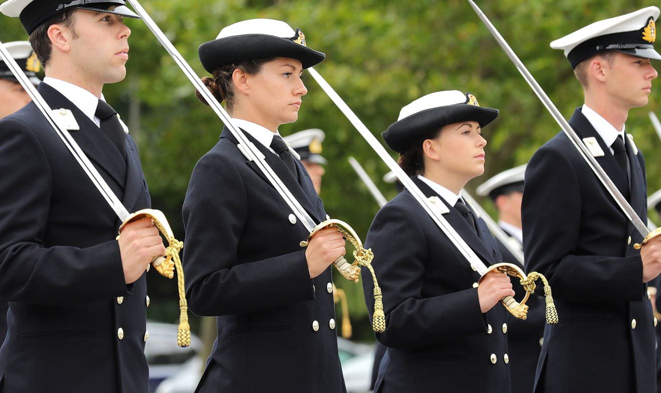 Royal Navy Reserve officers standing in line at passing out parade