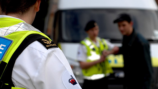 Two Royal Navy Policemen riding horses.