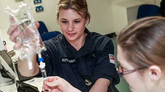 Student naval nurse at work