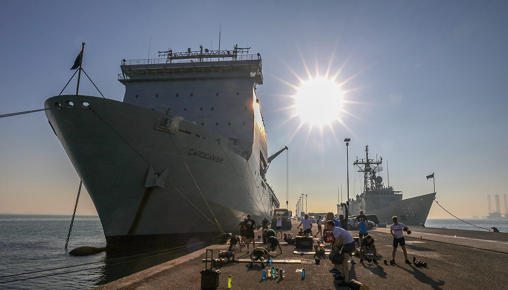 royal-navy-careers-RFA-life-02 RFA Cardigan bay alongside Manama, Bahrain, with the crew of HMS MONTROSE doing circuits on the jetty.