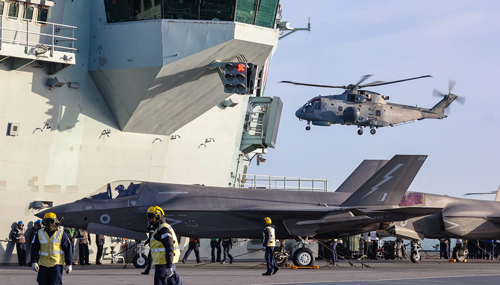 Merlin Mk2 Helicopter takes off from the flight deck of HMS Queen Elizabeth for the final time during CSG21.