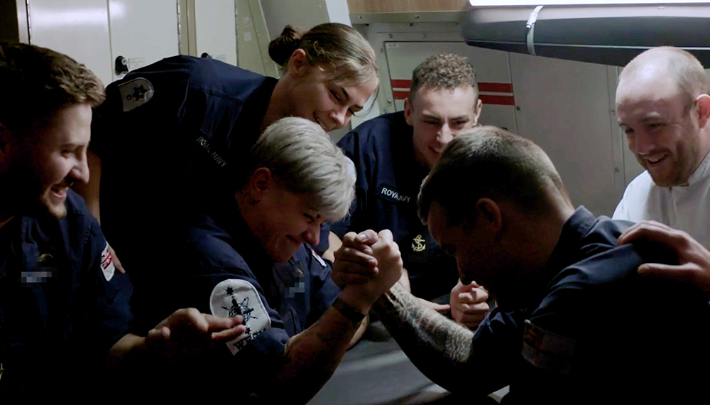 royal-navy-careers-submarine-service-04 Ship company smiling and watching a playful arm wrestle. The navy is built on trust and support. Living, working and socialising together in a unique under sea environment.