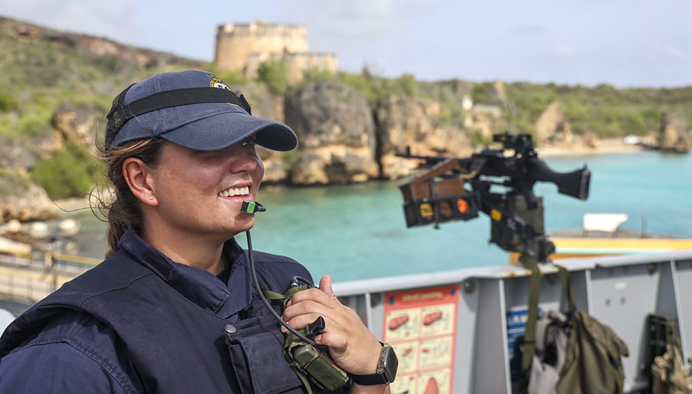 royal-navy-careers-surface-fleet-04 A Royal Navy Gunner smiles after safely over seeing the ships passage. HMS Medway arrives in Curacao for a stores replenishment.