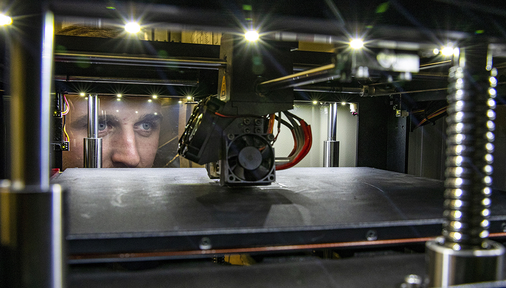 Navy engineer designing and produced the MFD clip using a printer