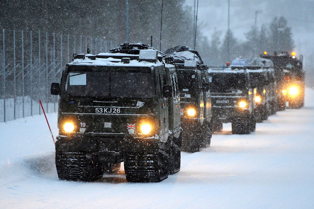 Royal-Navy-Equipment-Commando-By-Land-07-BV-206 A convoy of BVs driving through snow