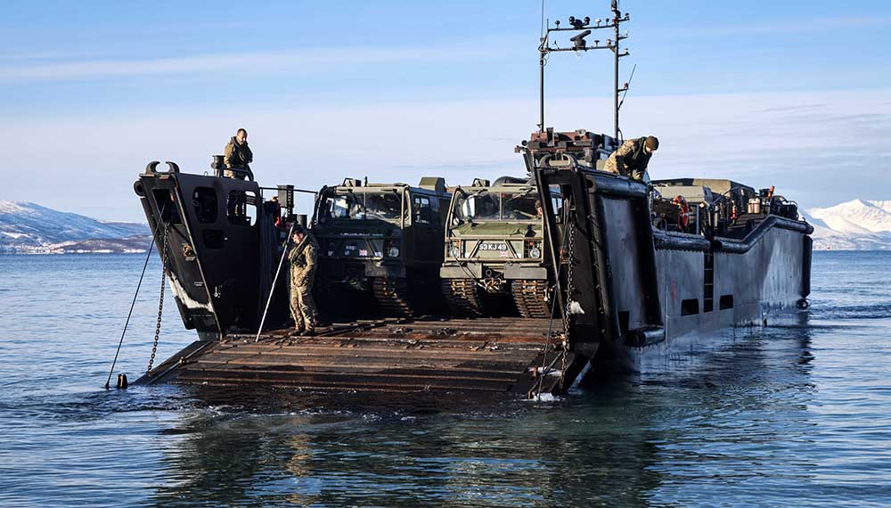 Royal-Navy-Equipment-Commando-By-Sea-06-LCU-MK10 Marines unloading vehicles from an LCU