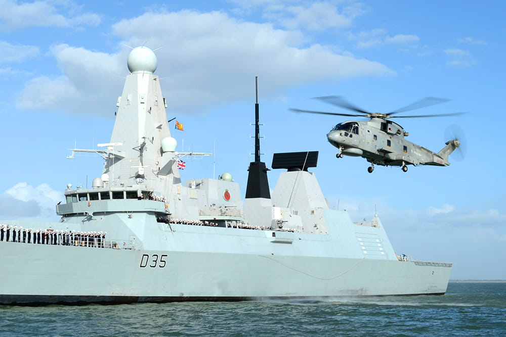 Royal-Navy-Equipment-Daring-Class-04-sea-and-skies.jpg Royal Navy Merlin helicopter flies alongside HMS Dragon