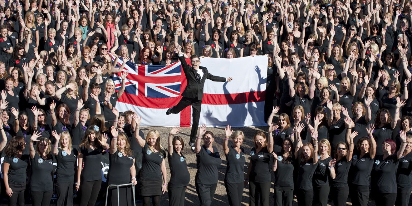 Royal-Navy-Local-Community-Centres-01-Get-Involved Gareth Malone surrounded by over 600 members of the military wives choir