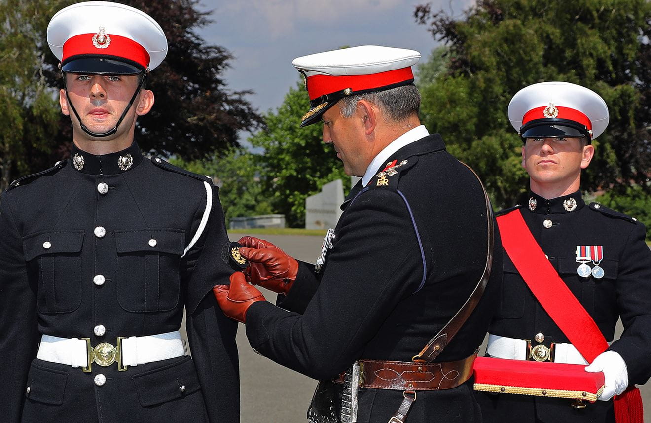 Royal-Navy-Bases-and-Stations-Lympstone-03-badge Deputy Commandant General presents the Kings Badge to Marine Howard