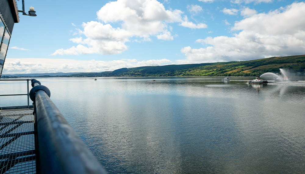 An image of the port of the clyde taken from the port side of a larger Navy boat