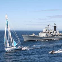 A duke class frigate, a sailing boat and a small patrol boat sail past the camera.