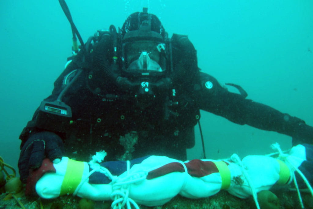 Divers salute the Royal Oak