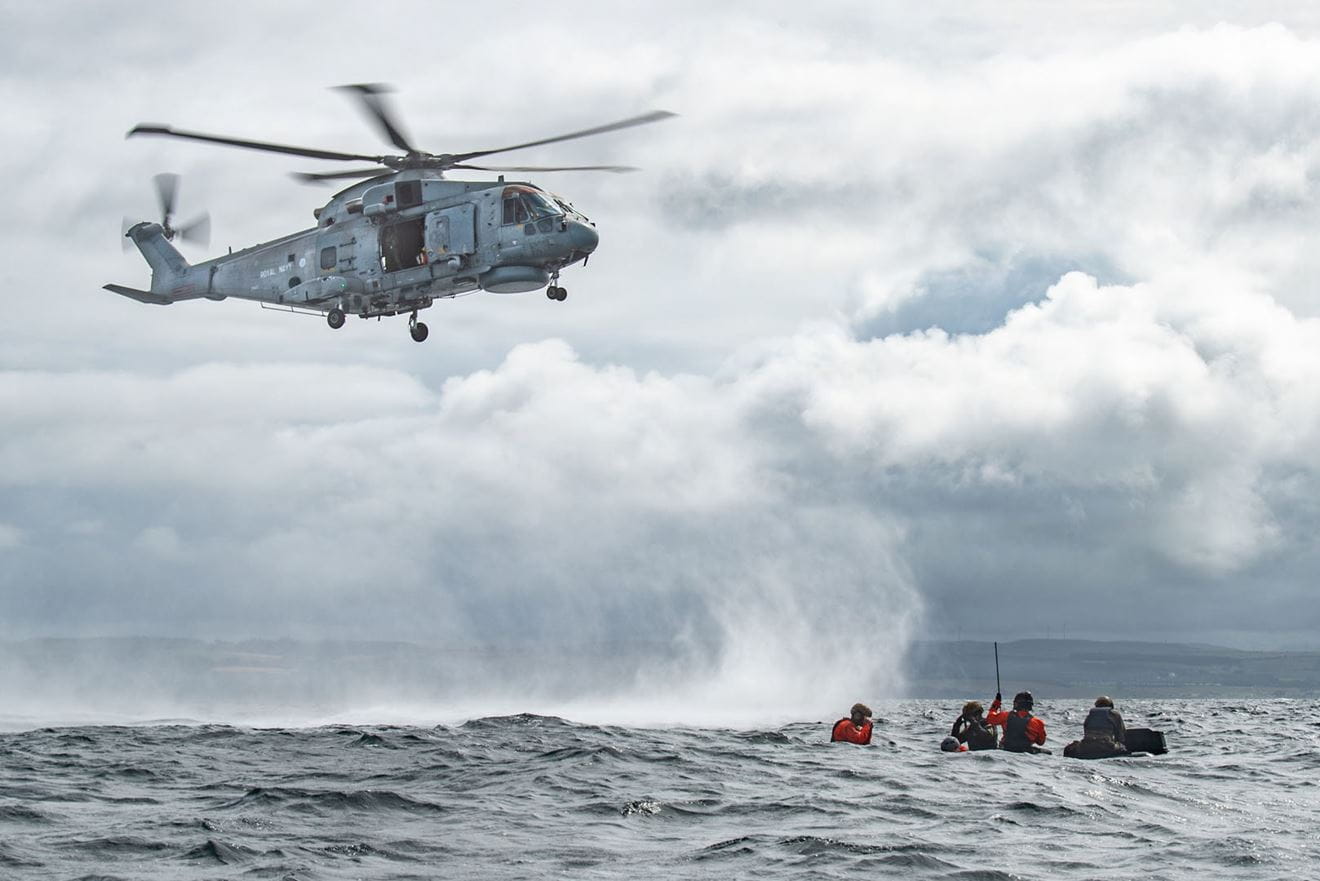 A Merlin arrives on the scene to conduct the last act of the rescue A Merlin arrives on the scene to conduct the last act of the rescue