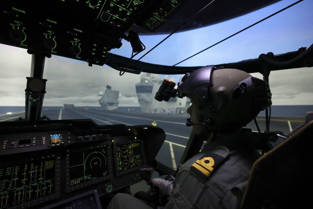 A pilot from 820 NAS practises operations from a Queen Elizabeth class aircraft carrier in one of the simulators at RNAS Culdrose A pilot from 820 NAS practises operations from a Queen Elizabeth class aircraft carrier in one of the simulators at RNAS Culdrose