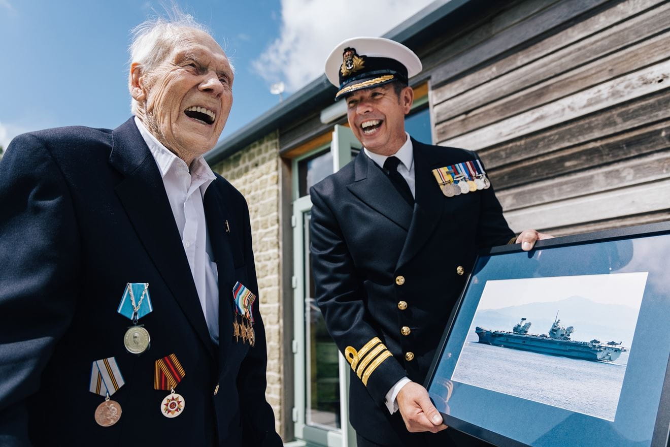 Commander Rich Thurman presents Horace with a framed picture of HMS Queen Elizabeth Commander Rich Thurman presents Horace with a framed picture of HMS Queen Elizabeth