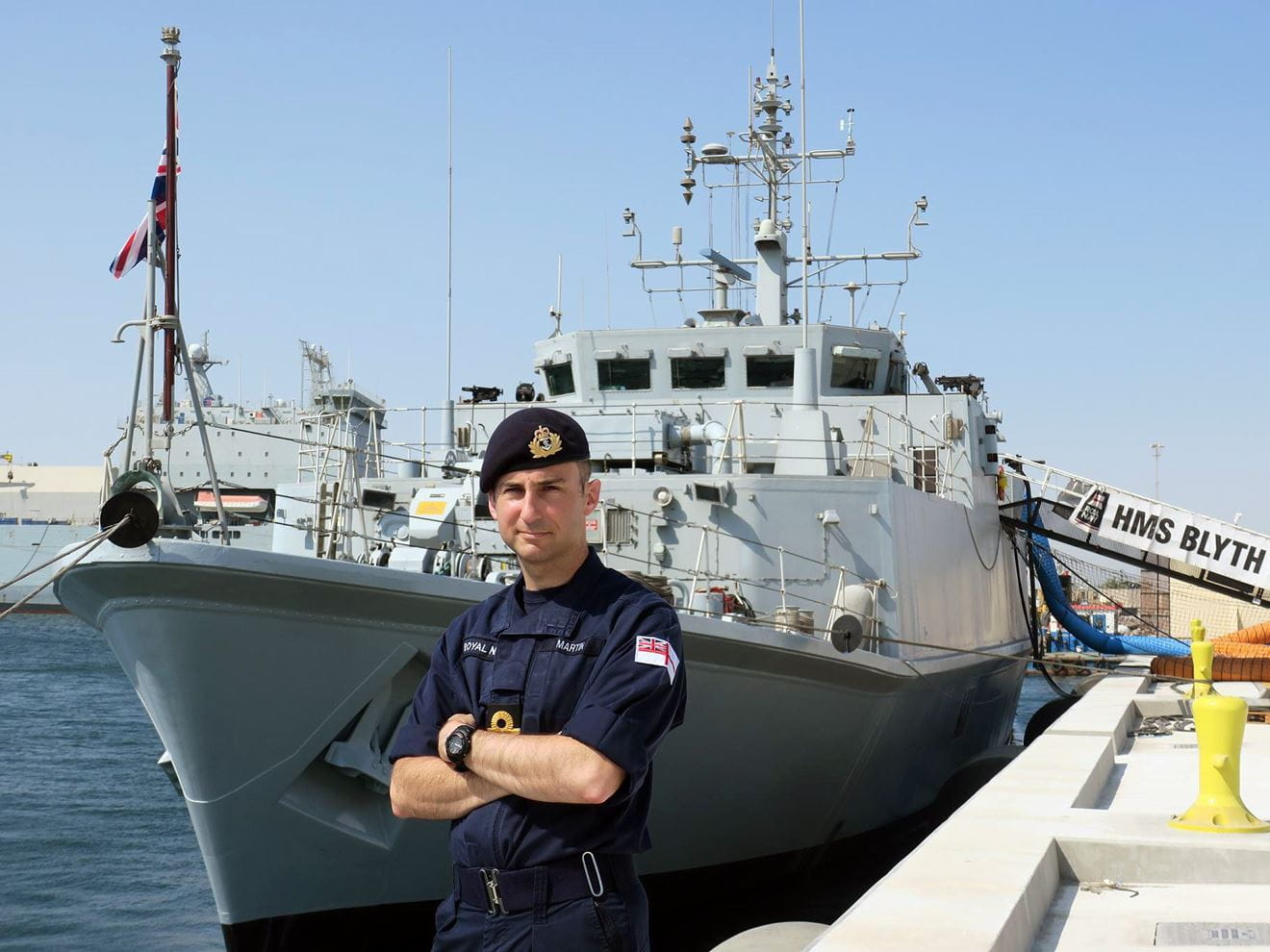 Lieutenant Commander Ben Martin in front of HMS Blyth Lieutenant Commander Ben Martin in front of HMS Blyth