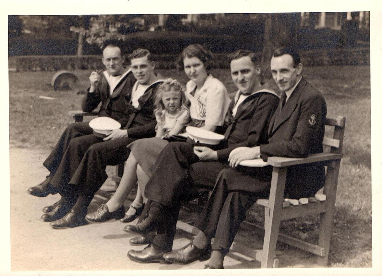 Four sailors with Mrs Casey and one of her daughters in a New York park Four sailors with Mrs Casey and one of her daughters in a New York park