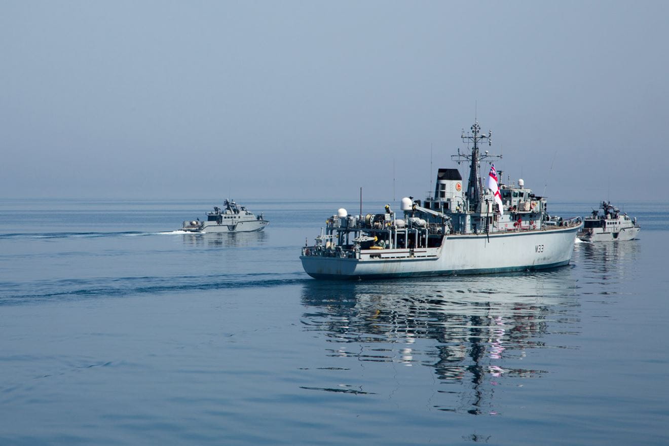 Two US Mk VI Patrol boats shepherd HMS Brocklesby Two US Mk VI Patrol boats shepherd HMS Brocklesby