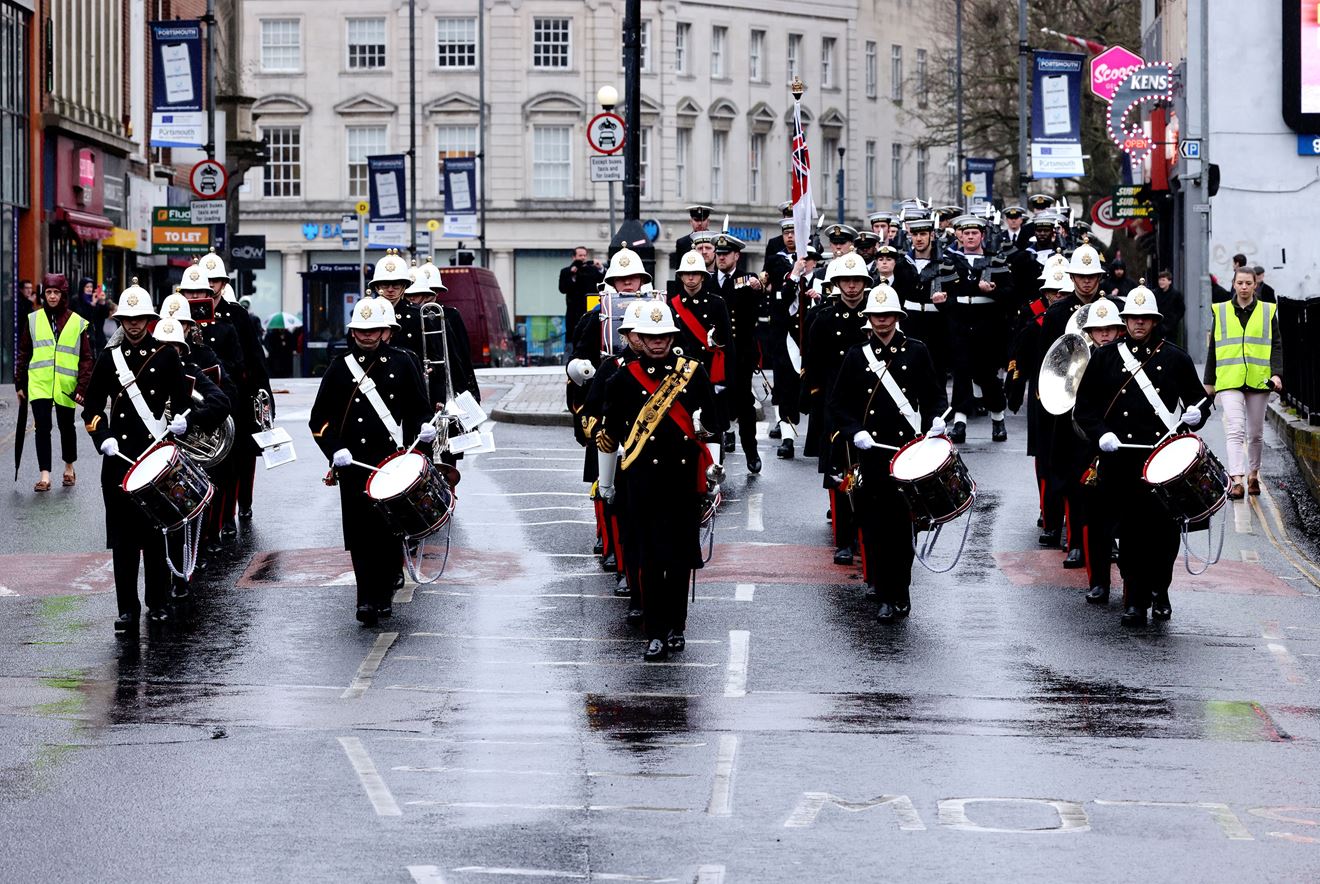 Personnel exercise their right to march through Portsmouth