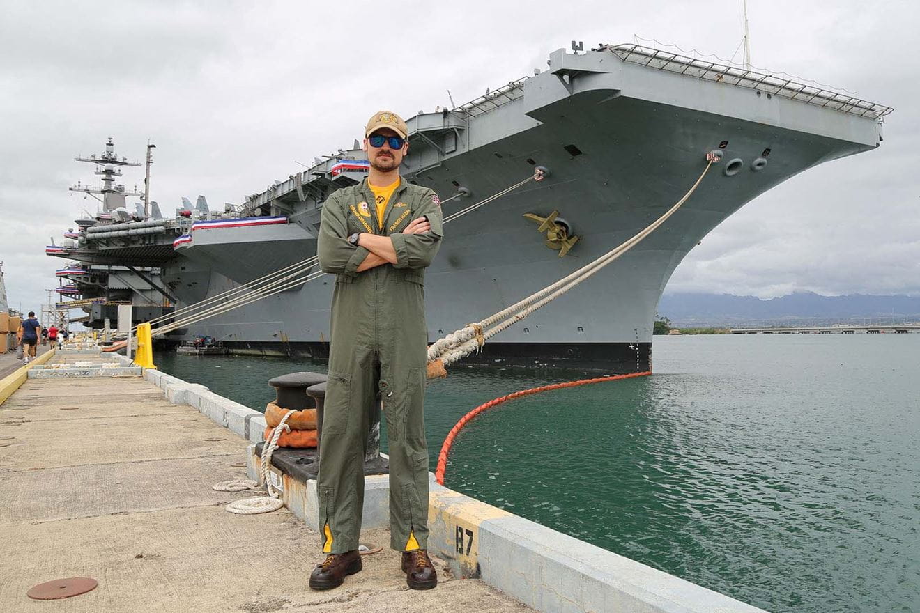 Lt Fraser Nadine in front of USS Carl Vinson berthed in Pearl Harbor