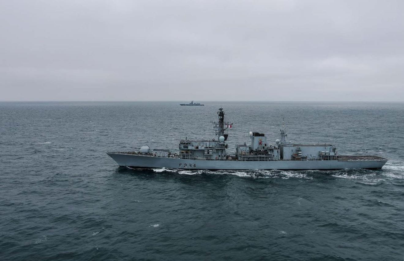HMS Iron Duke (nearest camera) monitoring RFS Golovko in the English Channel