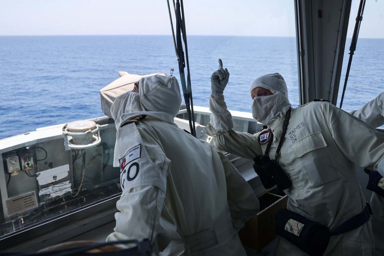 Cdr Pete Evans and Sub Lt James on HMS Diamonds bridge watch a Sea Viper missile intercept an incoming attack