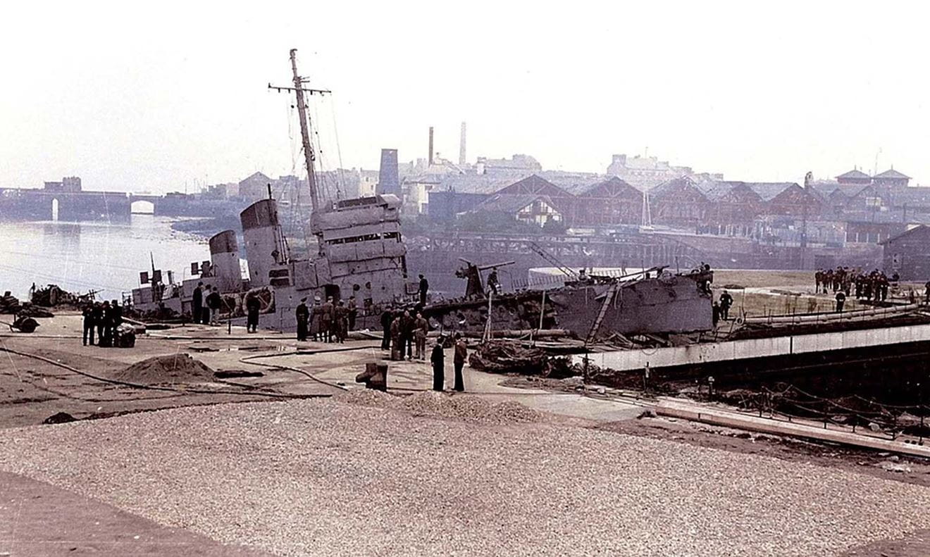 A rare colour image of HMS Campbeltown rammed into the dock gate