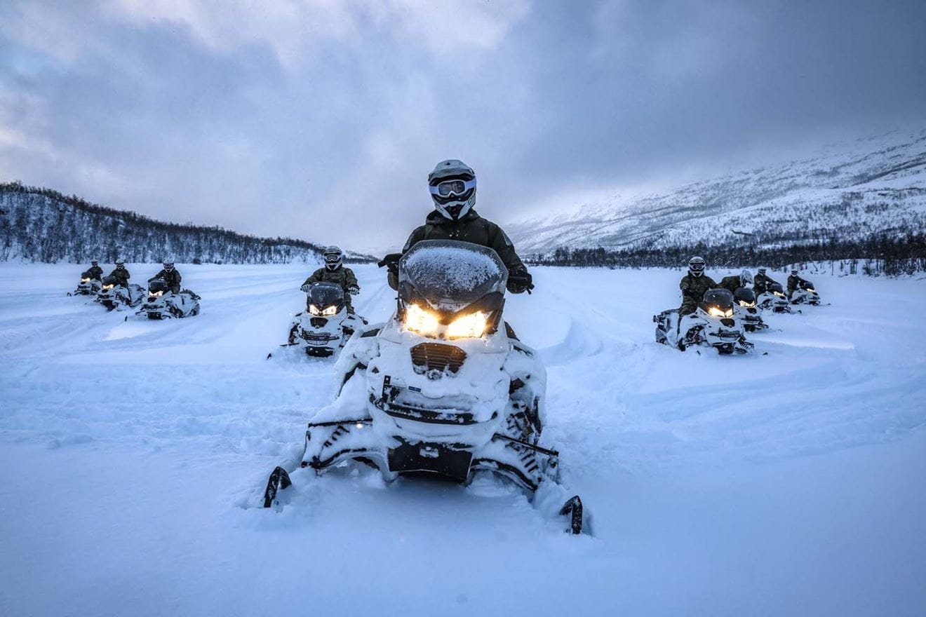 Snowmobiles in action in the arctic