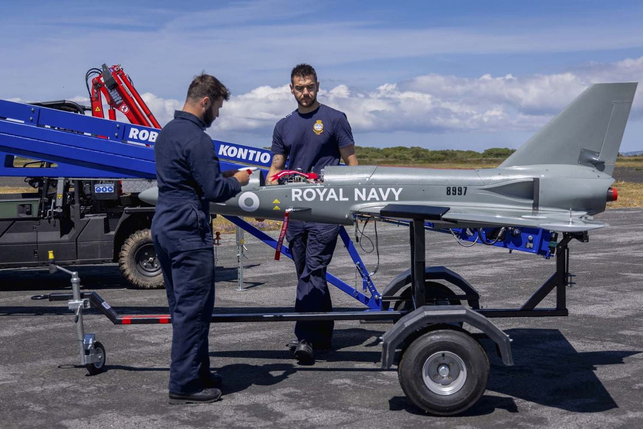 The Banshee drone being loaded onto its launcher during an exercise