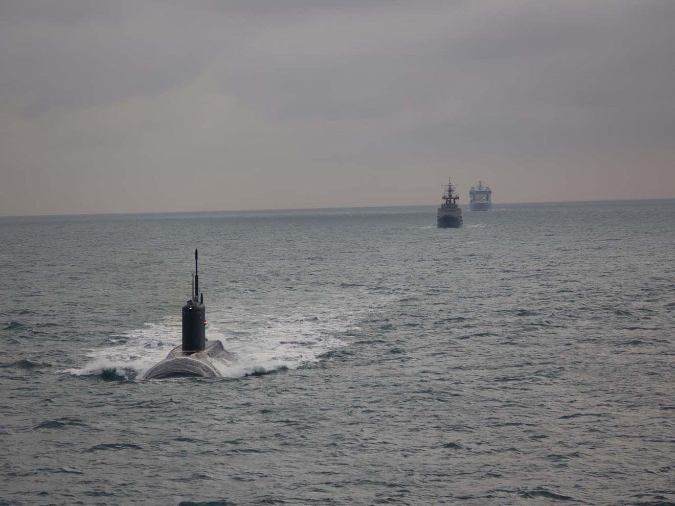 RFA Tidesurge tracks a Russian submarine and tugboat