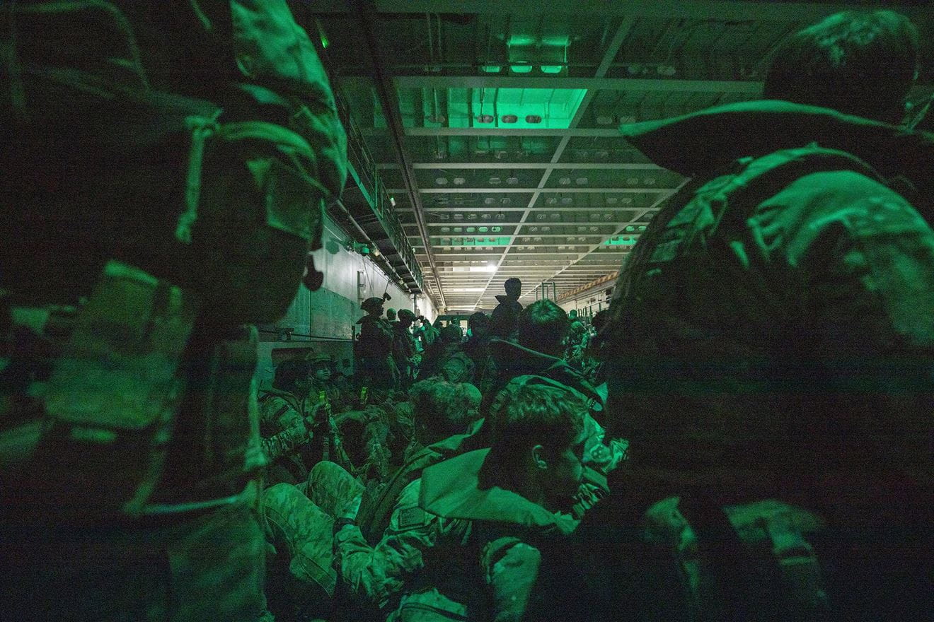 Men of 40 Commando are packed in an Australian landing craft ready for the dawn raid at Forrest Beach Men of 40 Commando are packed in an Australian landing craft ready for the dawn raid at Forrest Beach