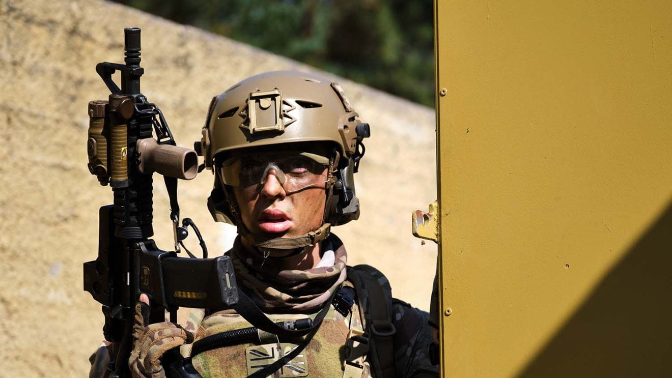 Royal Marines raid a compound held by terrorists during the final phase of their eight-week boarding course