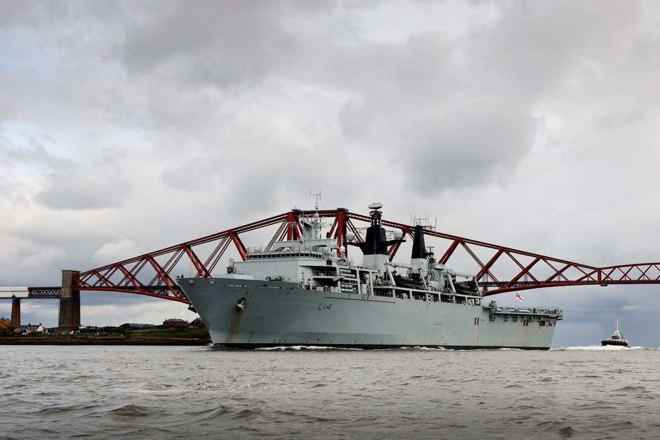 HMS Albion passes under the Forth Rail Bridge as she enters harbour at Crombie harbour.