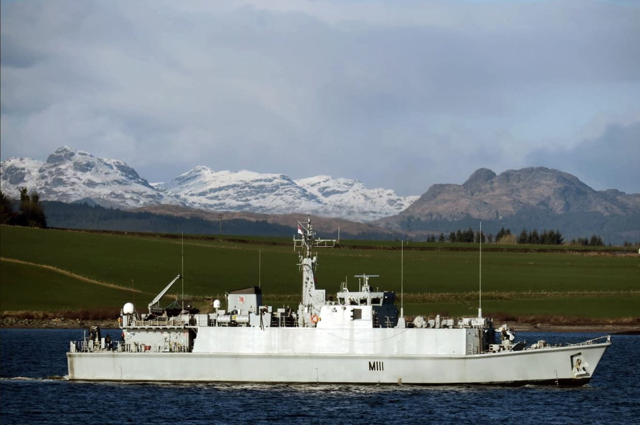 HMS Blyth sails down the Firth of Clyde past snow-capped peaks in the distance HMS Blyth sails down the Firth of Clyde past snow-capped peaks in the distance