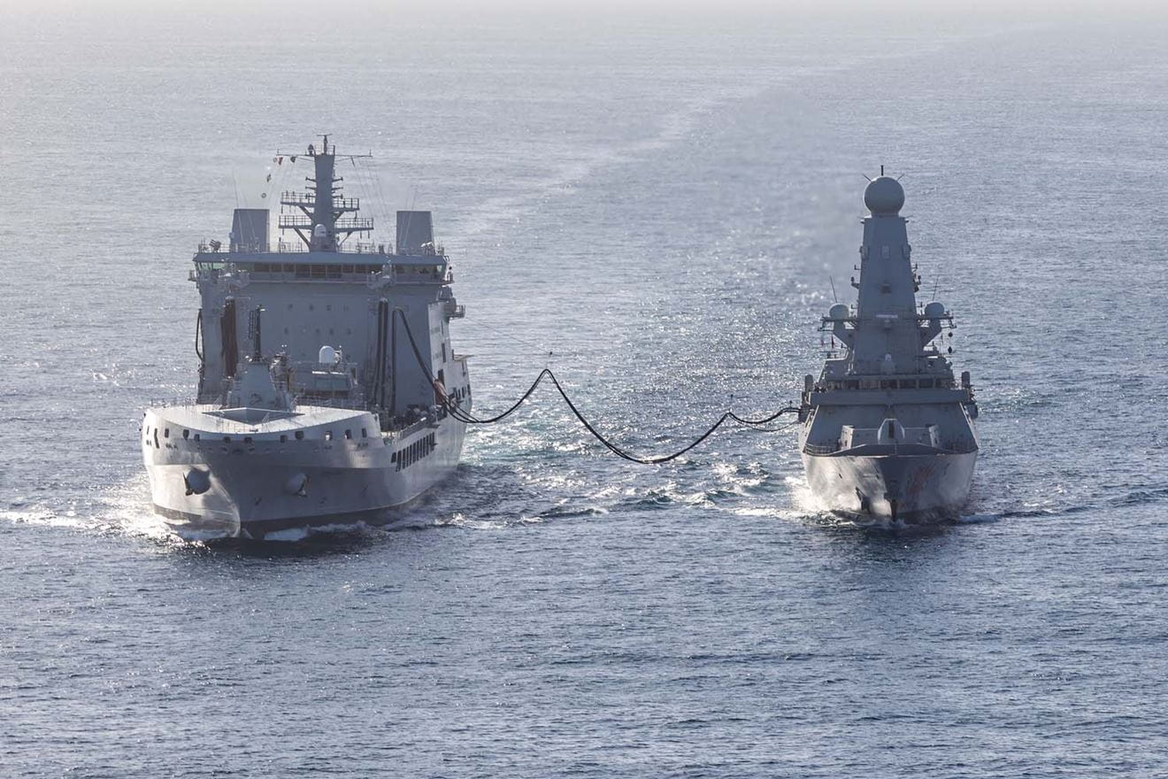 HMS Dragon conducting a Replenishment at Sea whilst undergoing Fleet Operational Standards and Training