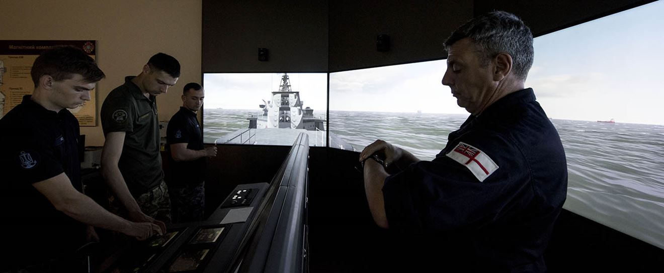  A team of specialists work with Ukrainian instructors and recruits to train them in ship navigation, firefighting, and damage repair