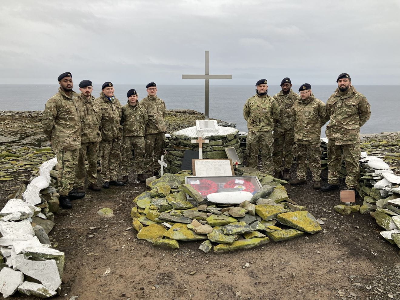 The NEFI team with the restored monument to HMS Sheffield on Sealion Island