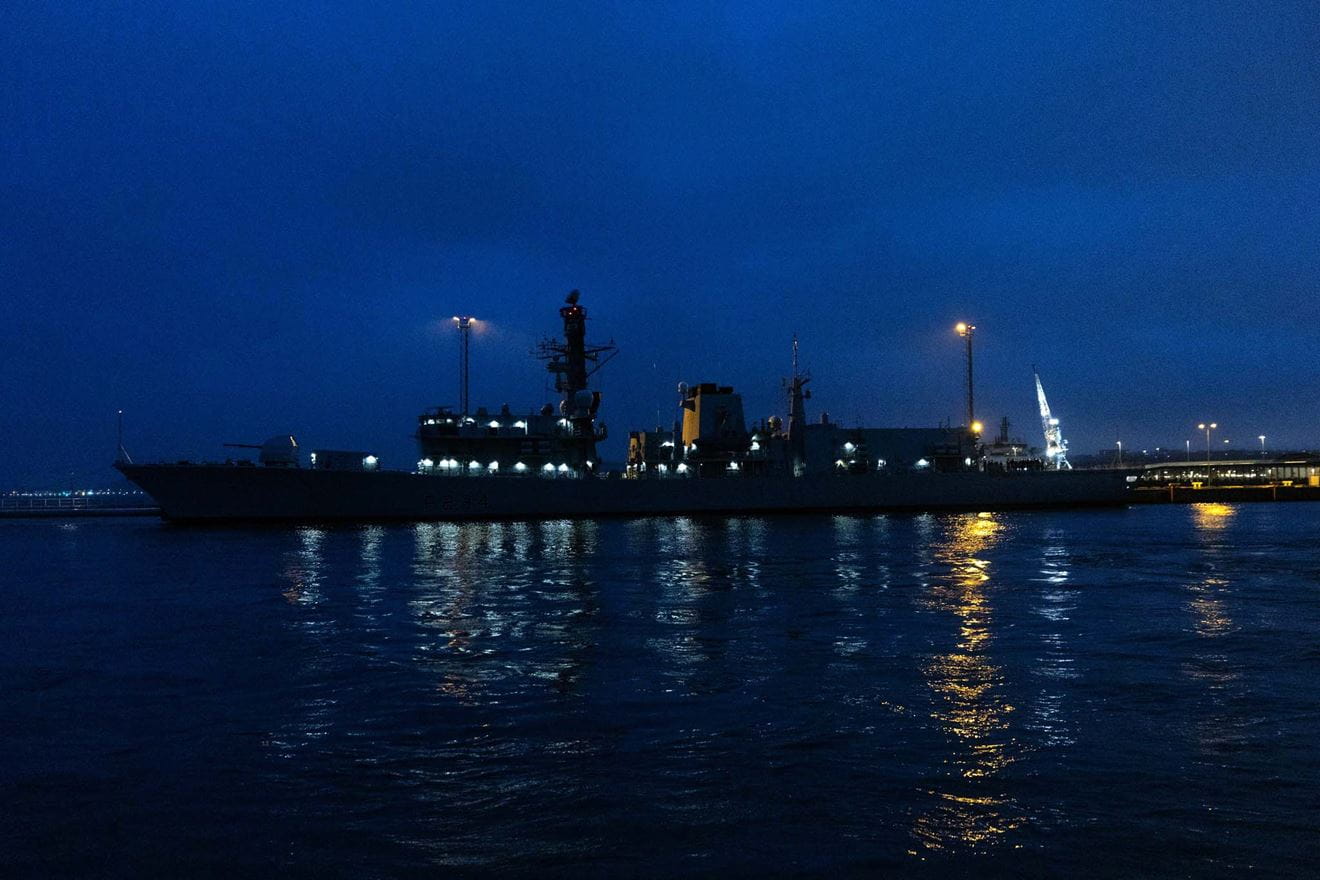 HMS Iron Duke lit up at night in Tallinn Naval Base - courtesy of Estonian Armed Forces