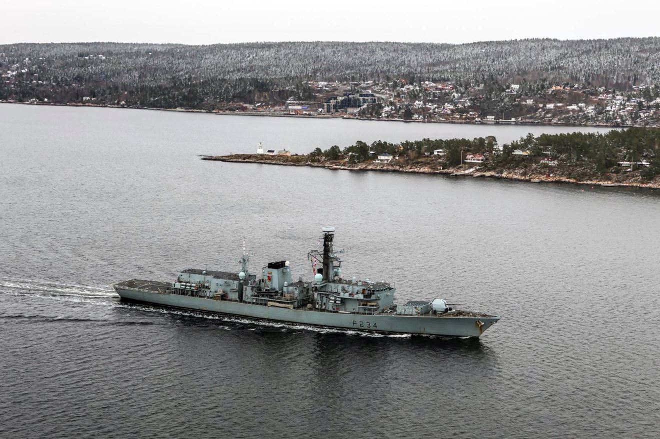 HMS Iron Duke passes the island of Søndre Langåra and the village of Nordre Spro HMS Iron Duke passes the island of Søndre Langåra and the village of Nordre Spro