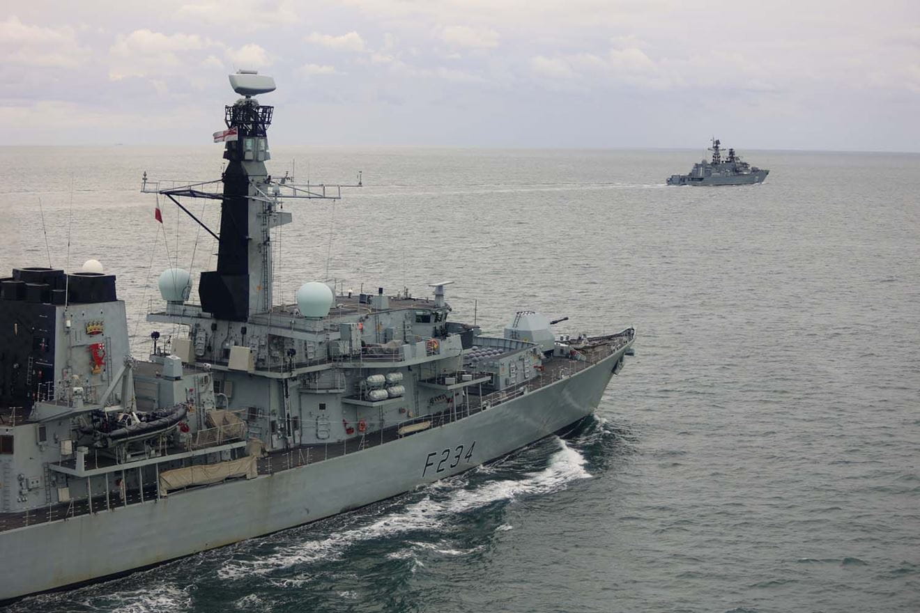 HMS Iron Duke tracks the progress of a Russian warship